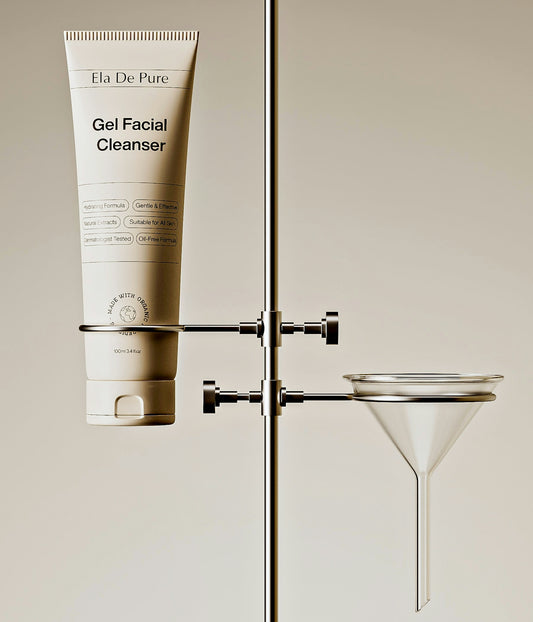 A facial cleanser bottle held on laboratory equipment.